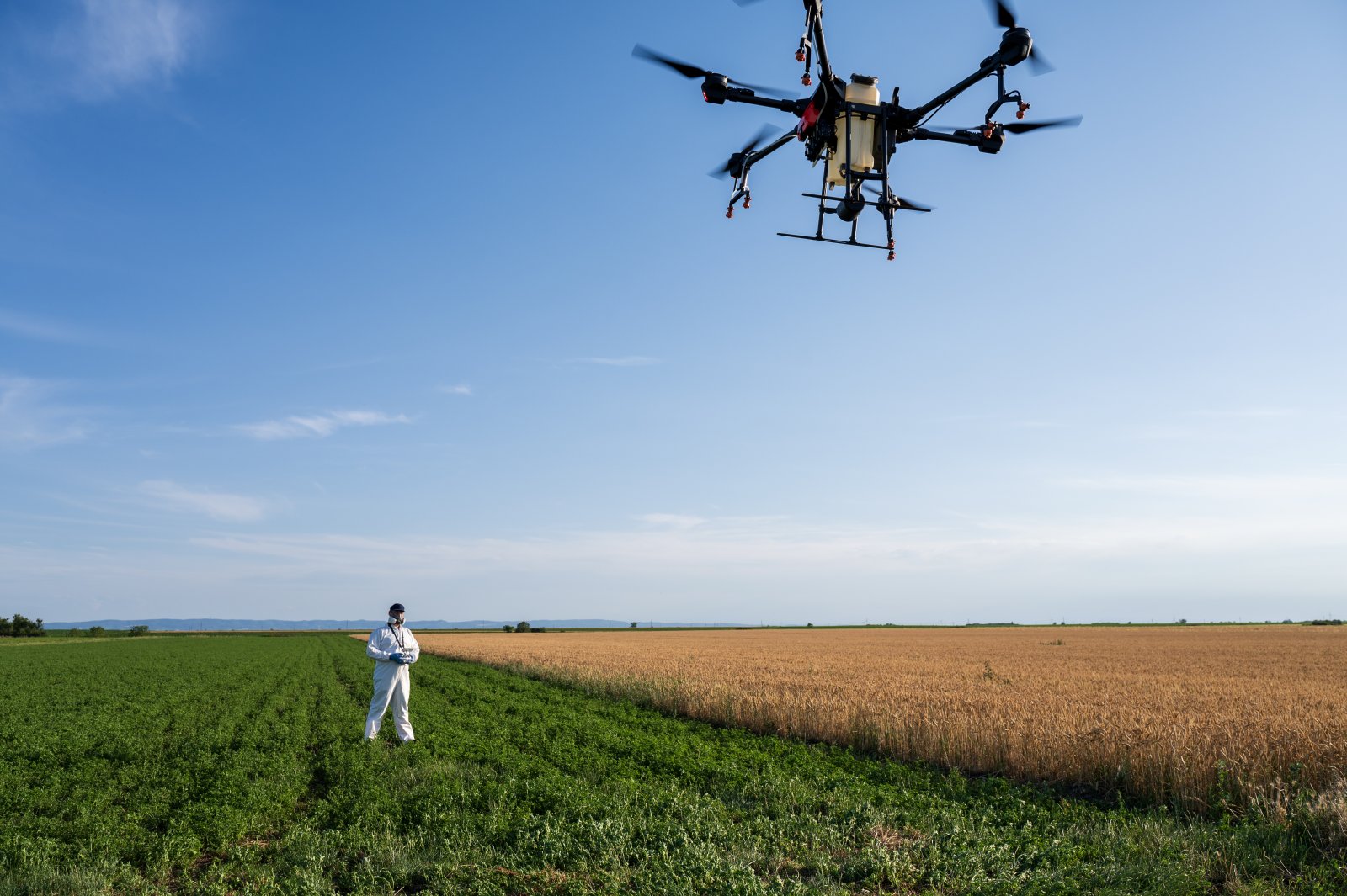 drone-operator-modern-farmer-flies-drone-over-agr-2024-06-12-19-29-56-utc
